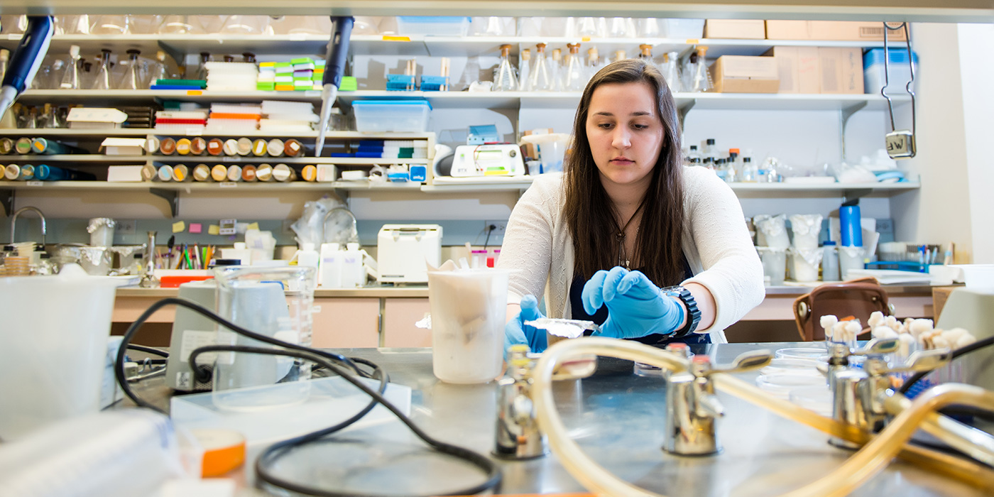 student in research lab