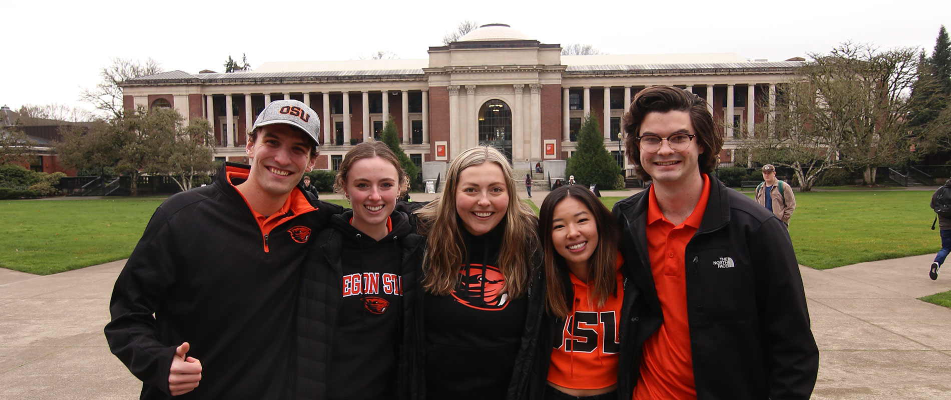 tour students in OSU gear standing in front of the MU