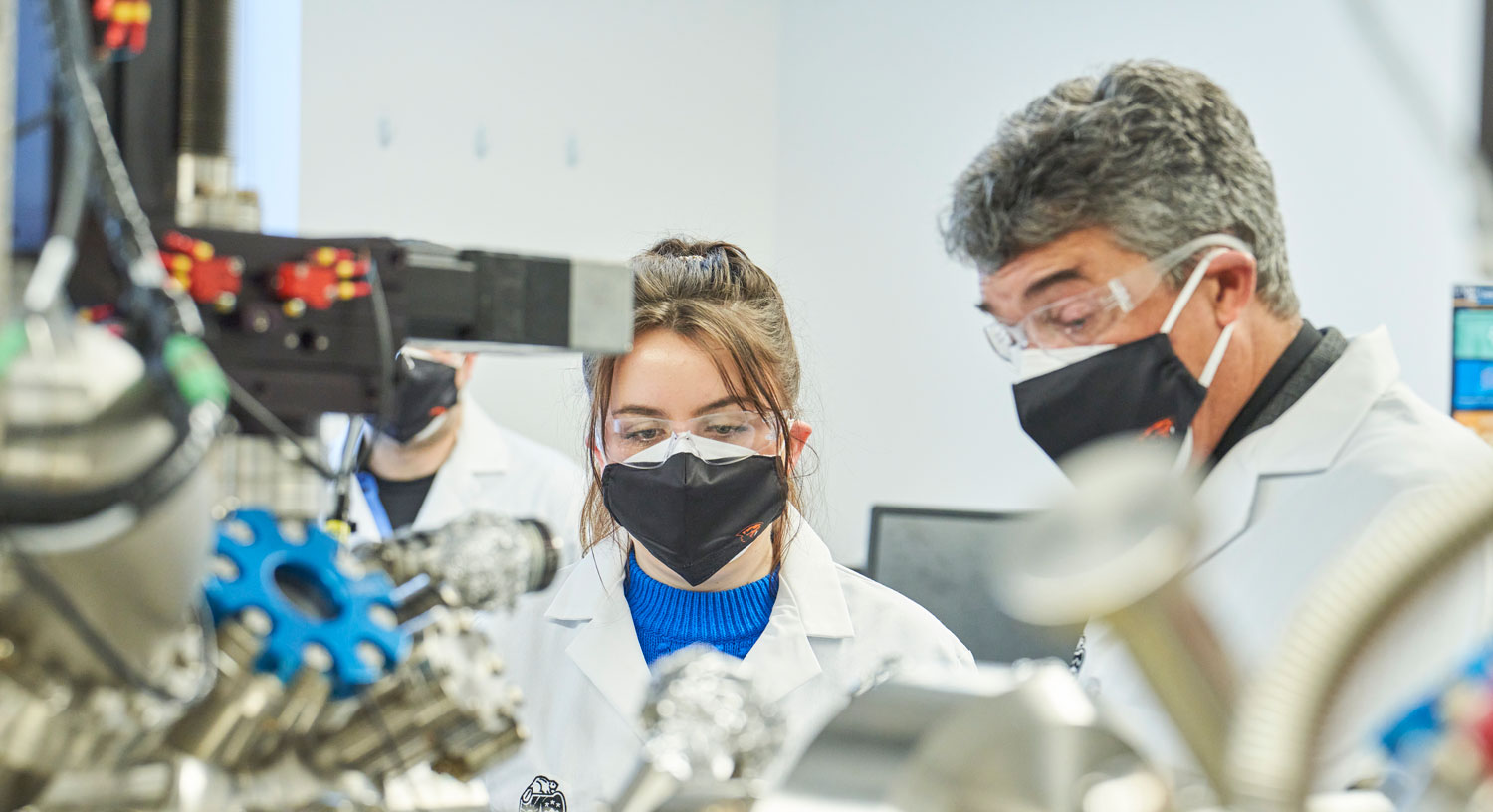 student and professor working in a lab
