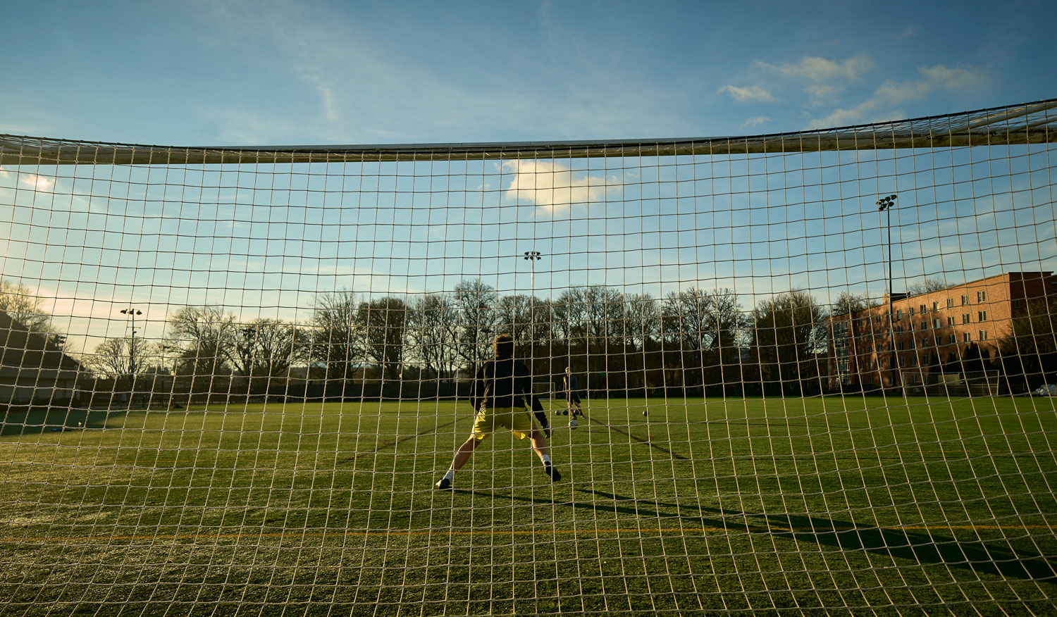 person guading a soccer goal
