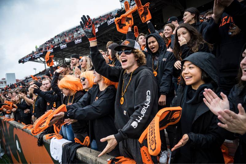 students cheering at football game