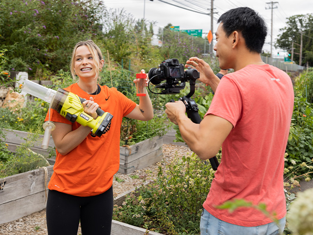 gardener showing filming crew tools