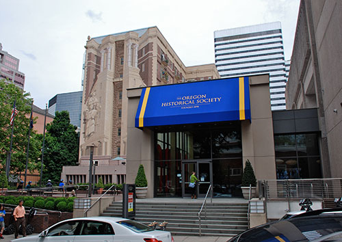 Oregon Historical Society with a blue overhang and a light stone building 