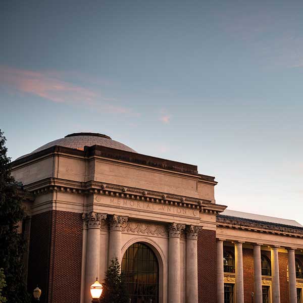 Memorial Union, a brick building with marble facing and dome at sunset