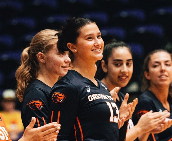 Vivian Light smiling on the volleyball court 